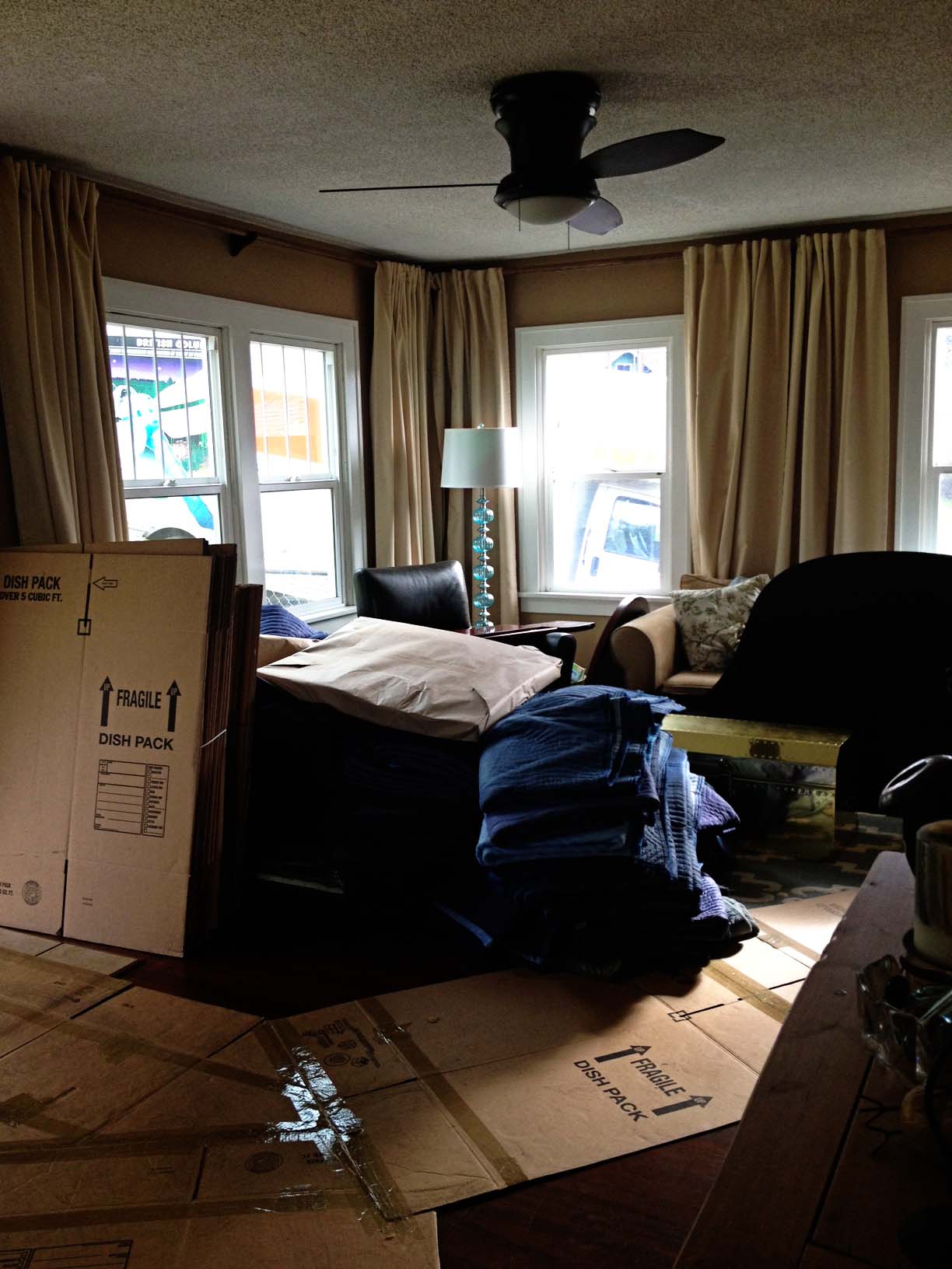 Moving boxes in living room.