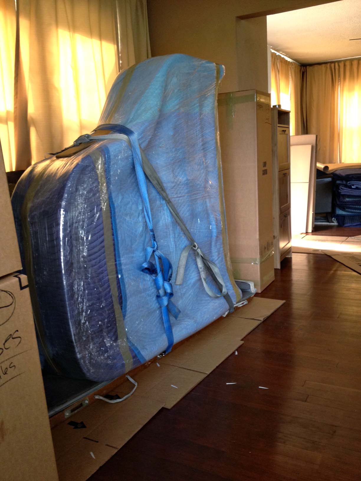 Piano wrapped up and ready to be put on moving truck. 