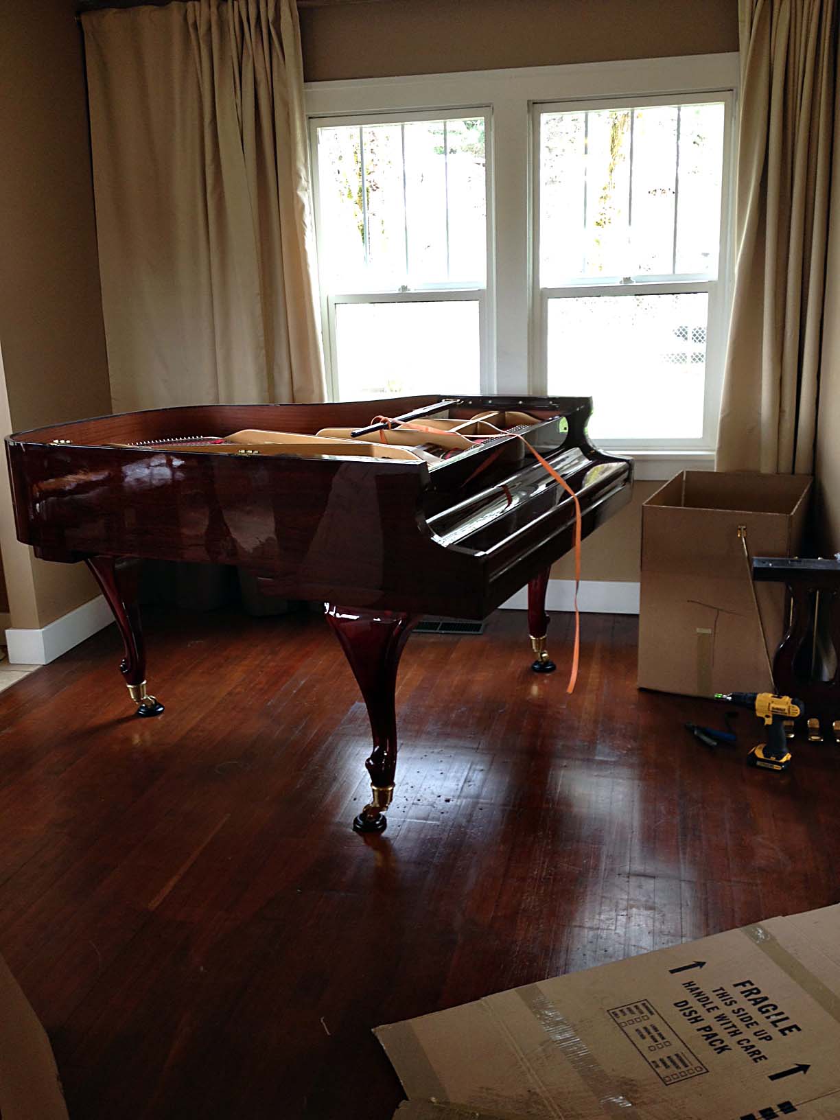 Piano preparing to be moved.