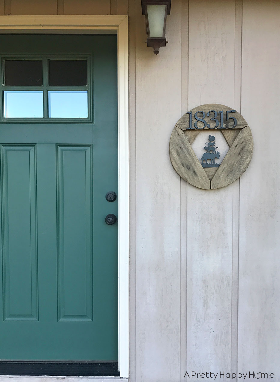 wooden spool house number sign