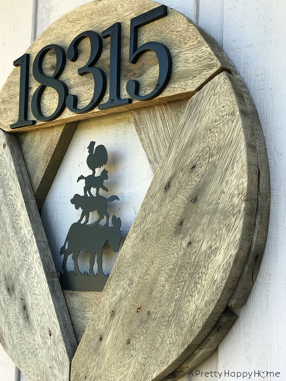 wooden spool house number sign