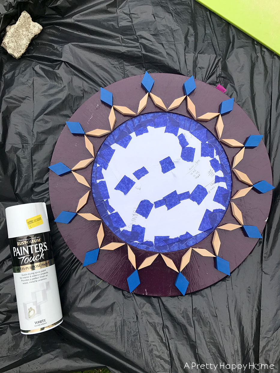 spray painting children's blocks on mirror