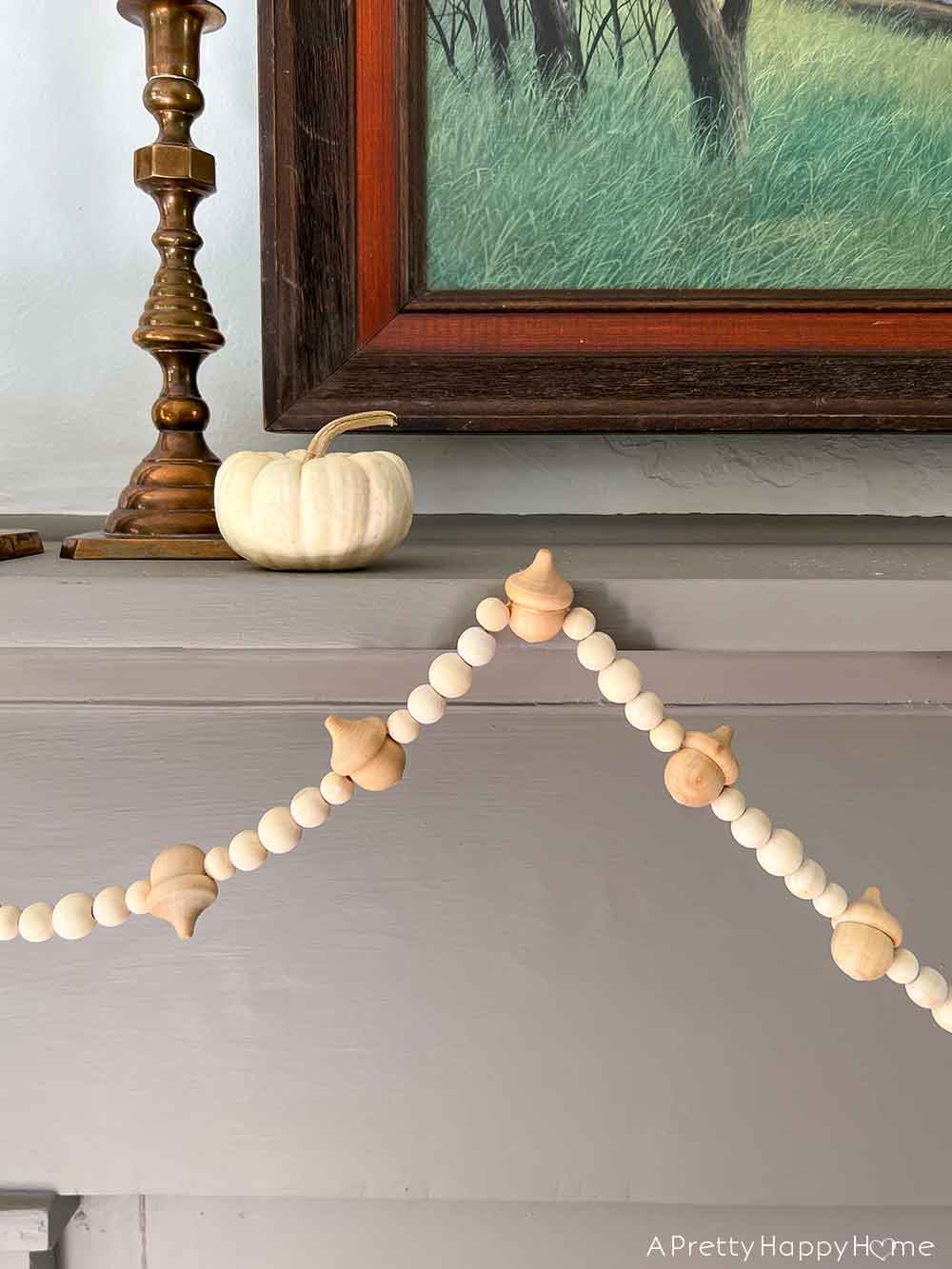 diy wood acorn garland fall garland using acorns and beads 13 diy fall decor ideas