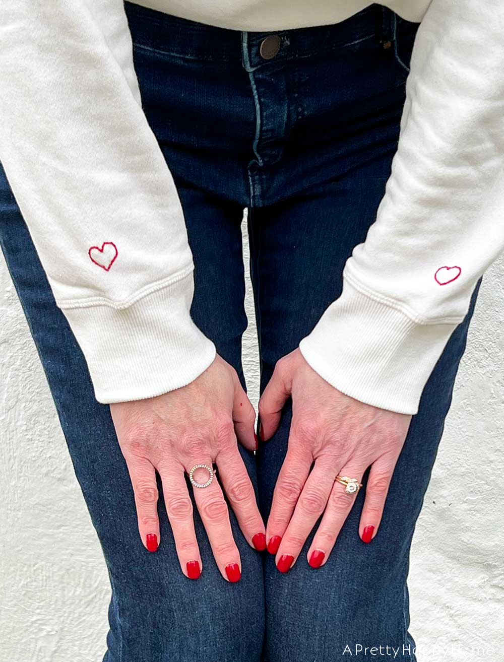 diy embroidered sweatshirt with hearts on sleeves diy embroidered heart hoodie handmade gifts ideas