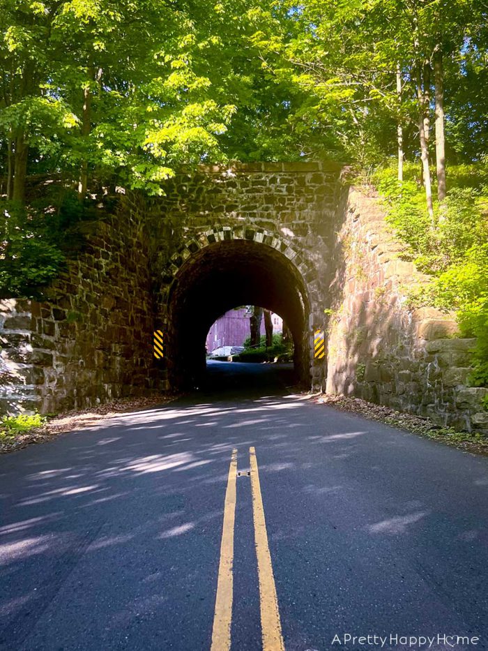 the charm of one-lane roads and bridges one lane road under railroad tunnel