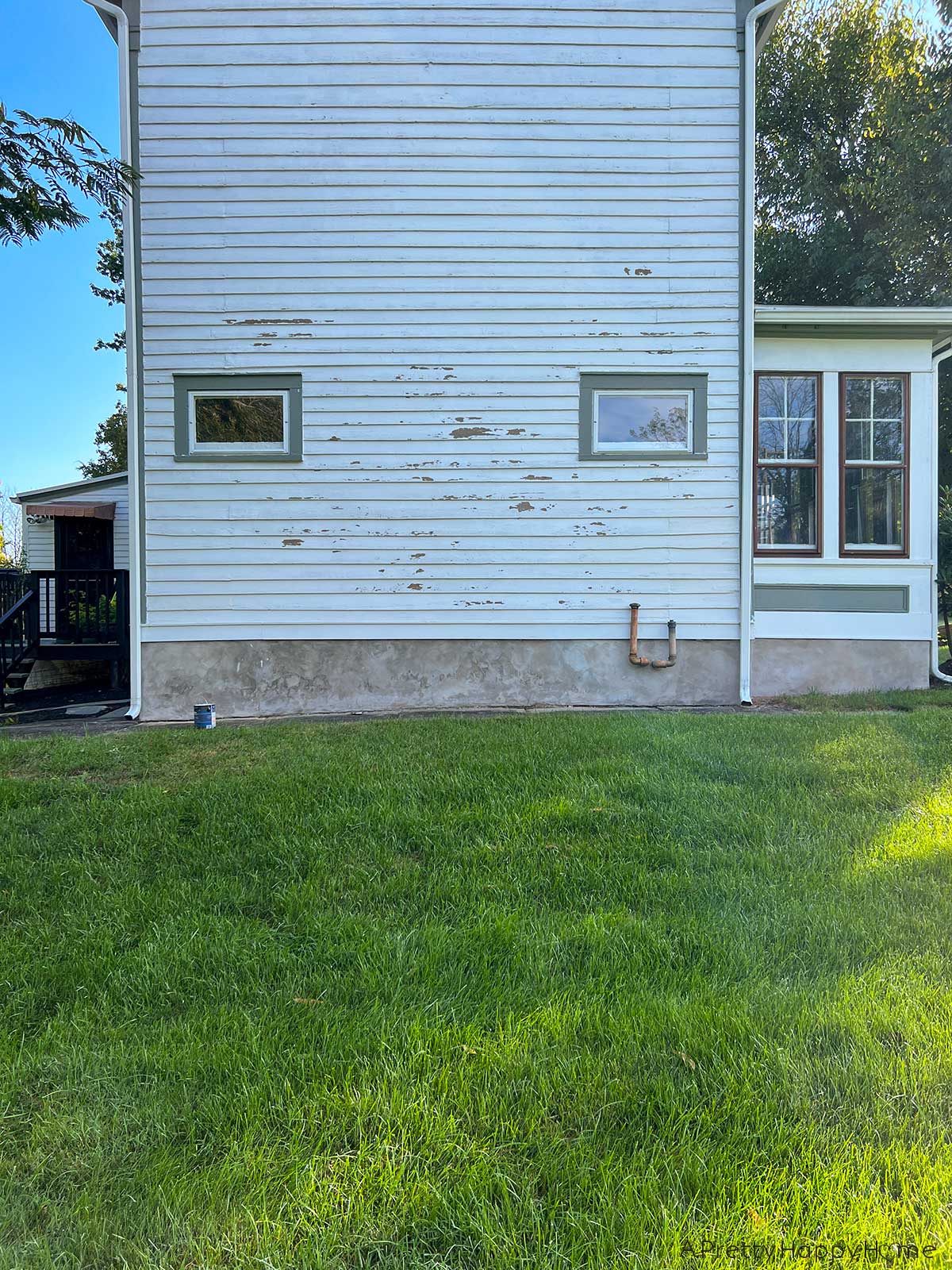 Caulk, Cracks, and Home Maintenance. Wood siding maintenance, scraping chipping paint, sanding, repainting on an old house