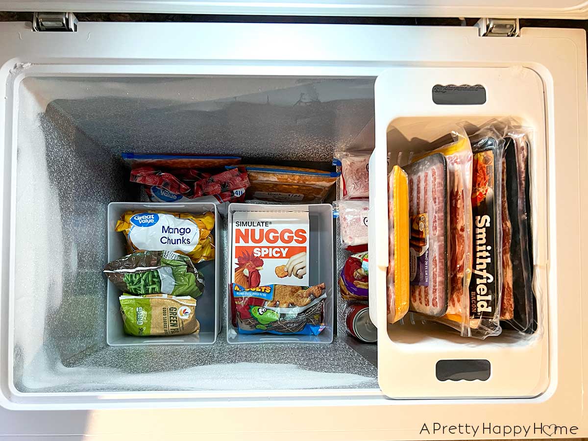 chest freezer organization tip use hanging baskets and stackable bins to organize a chest freezer