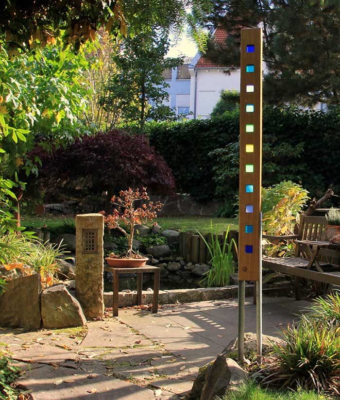 wood and stained glass garden sculpture from etsy shop Eichenstelen fun gardening finds