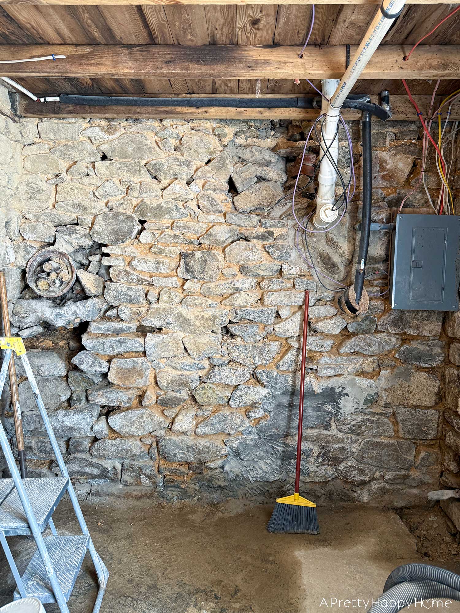 removing and demoing old lime mortar off a fieldstone foundation wall in order to repoint the wall with new lime mortar