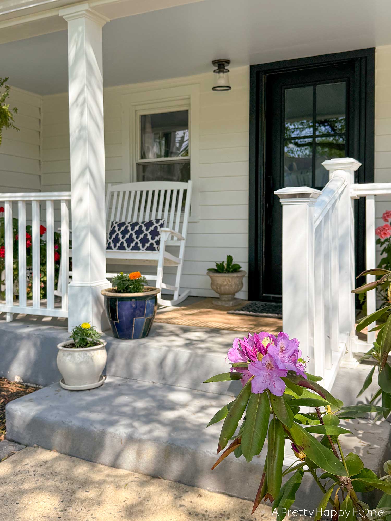 farmhouse front porch more seating with rockers and a light update