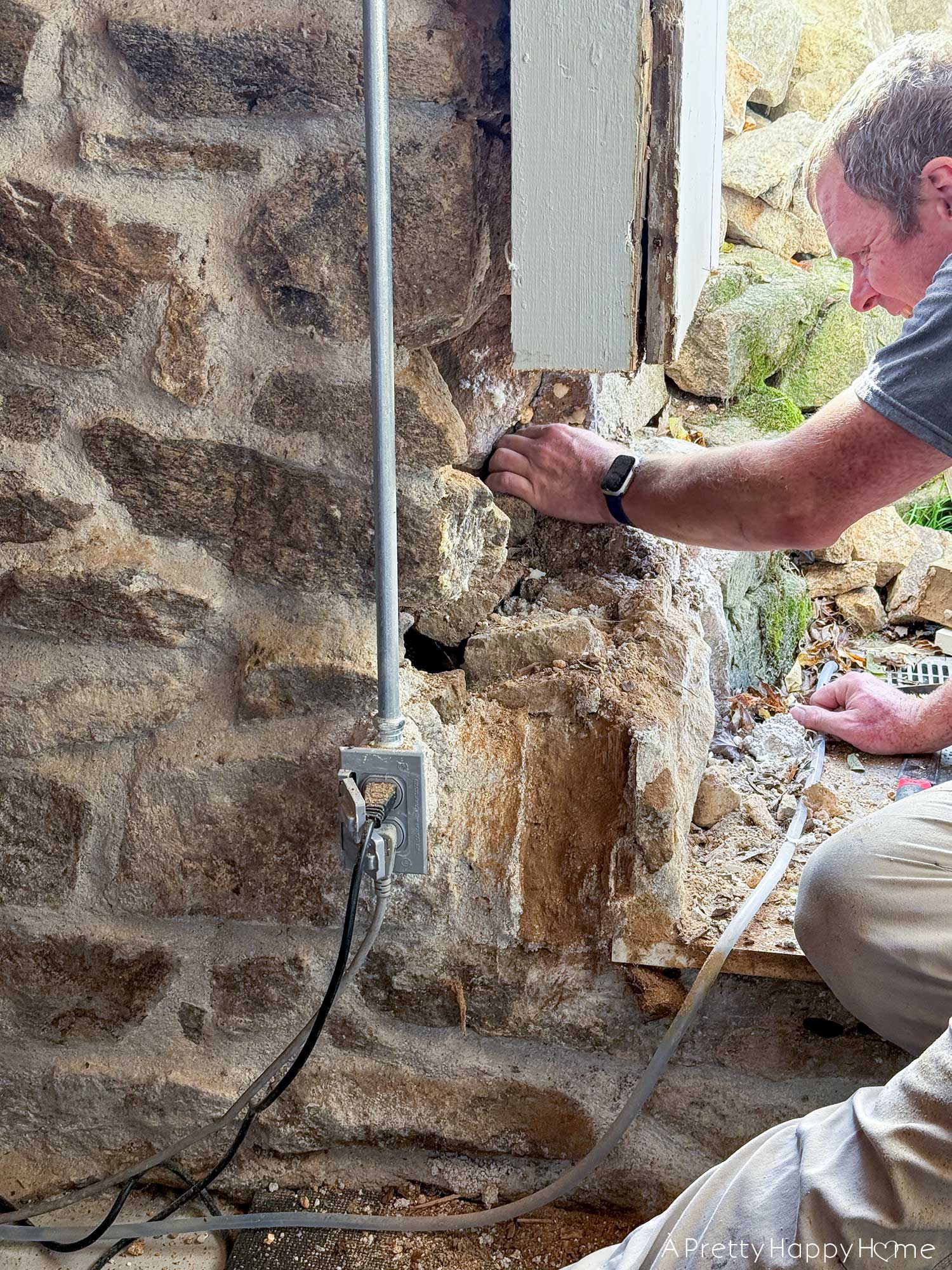 Converting a Door Into a Window In a Stone Building inside of a stone foundation in a 250 year old building